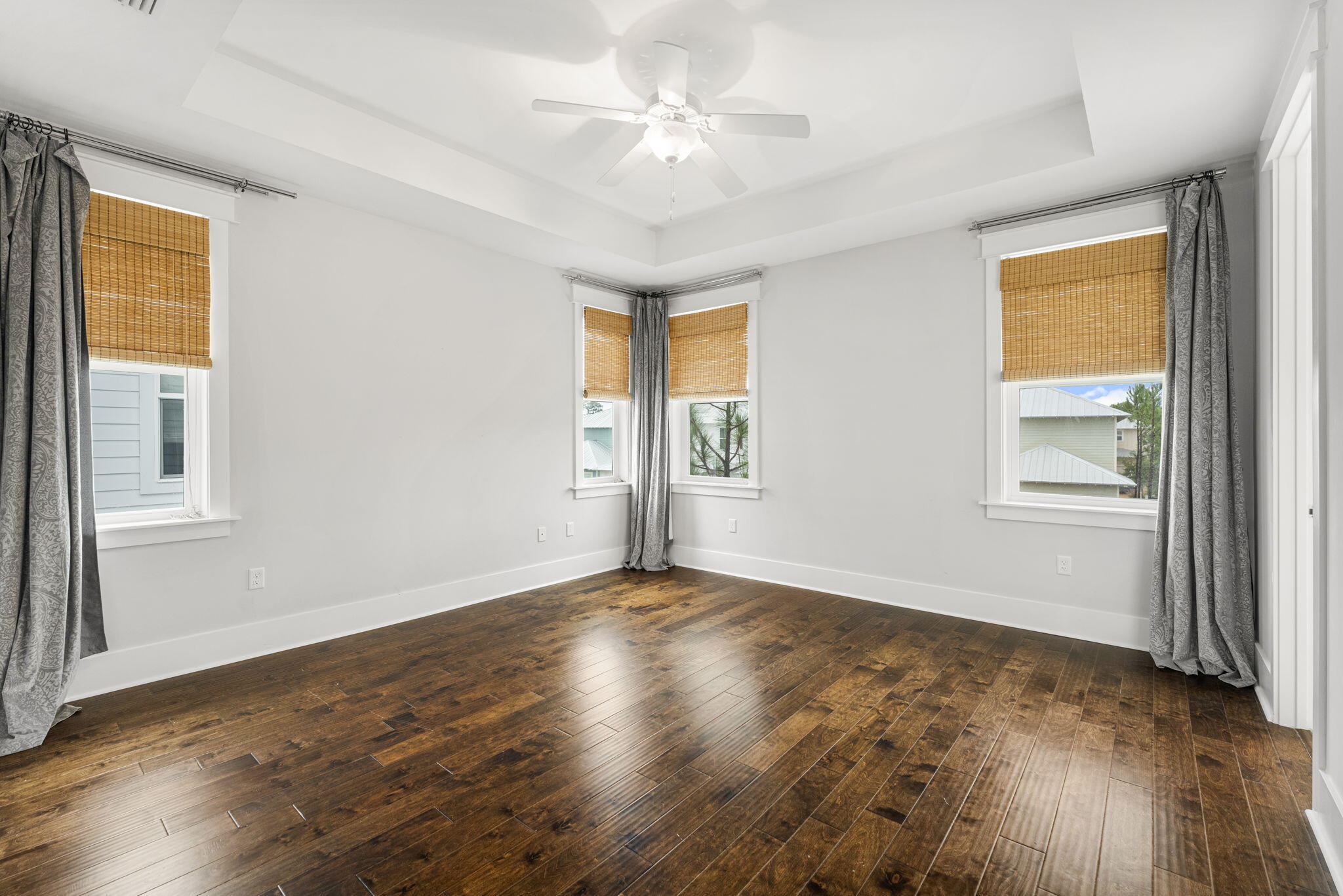 426 Flatwoods Forest Loop Santa Rosa Beach, FL 32459 - Photo 32 of 59 a view of an empty room with window and wooden floor