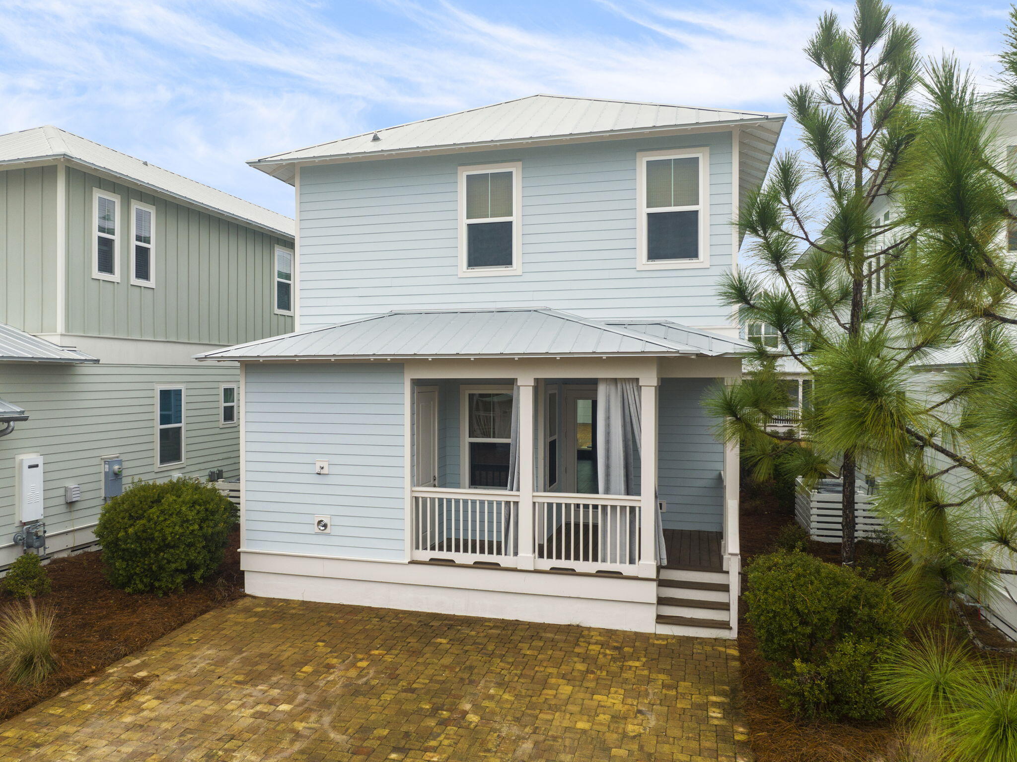 426 Flatwoods Forest Loop Santa Rosa Beach, FL 32459 - Photo 41 of 59 a view of a house with a small yard and plants with large tree