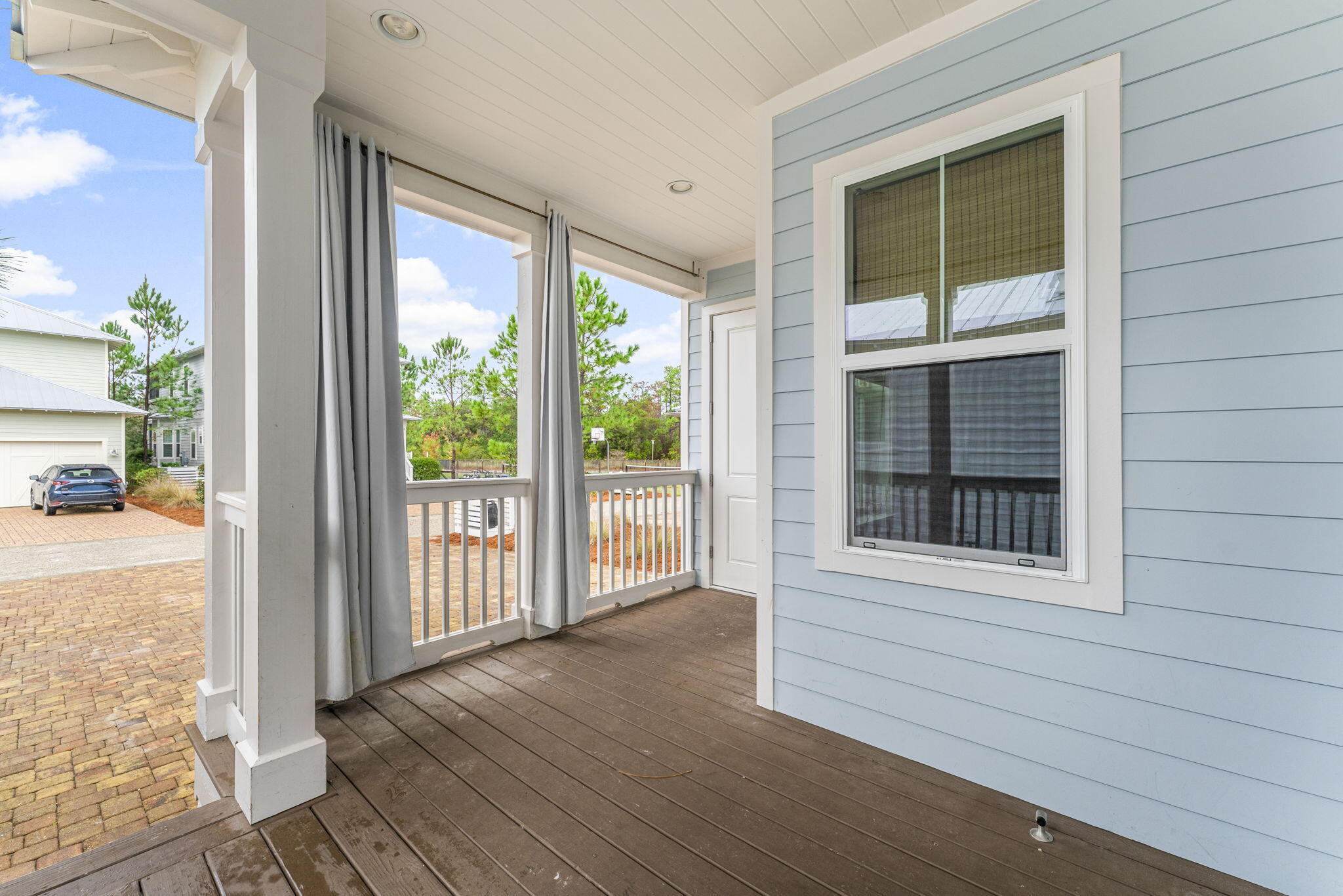 426 Flatwoods Forest Loop Santa Rosa Beach, FL 32459 - Photo 6 of 59 a view of an empty room with wooden floor and a window