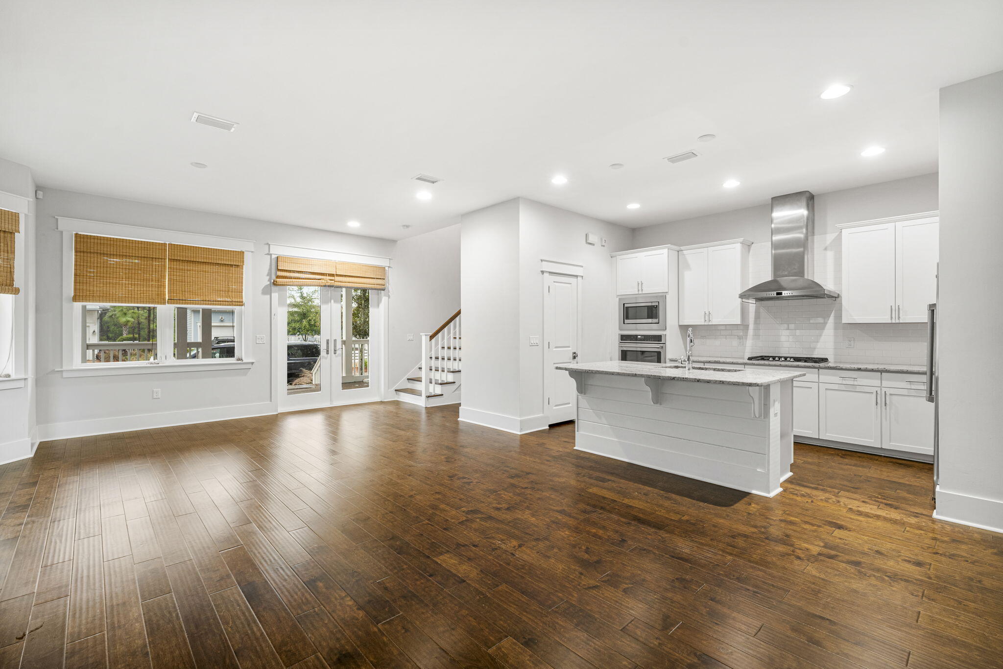 426 Flatwoods Forest Loop Santa Rosa Beach, FL 32459 - Photo 9 of 59 a large kitchen with granite countertop a large counter top stainless steel appliances and cabinets