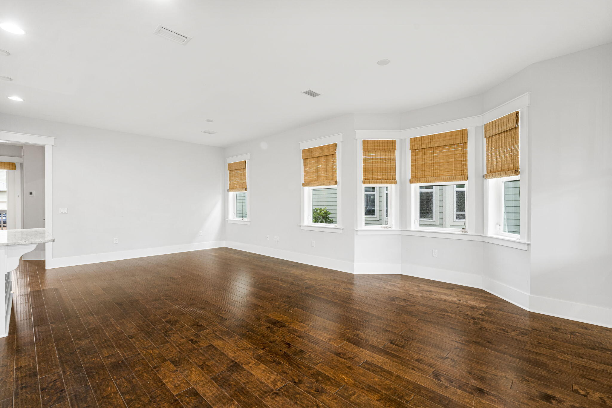 426 Flatwoods Forest Loop Santa Rosa Beach, FL 32459 - Photo 10 of 59 a view of an empty room with wooden floor and a window