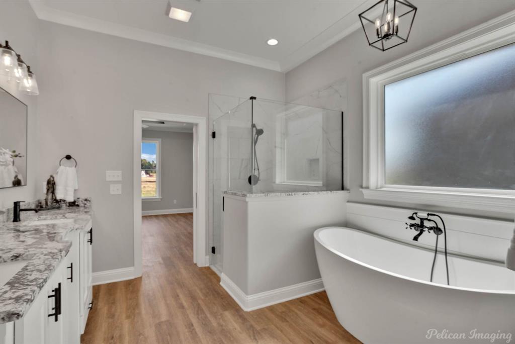 165 Oak Aly Road Stonewall, LA 71078 - Photo 19 of 36 a bathroom with a bathtub and a shower
