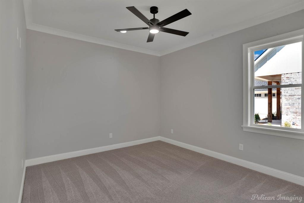 165 Oak Aly Road Stonewall, LA 71078 - Photo 26 of 36 an empty room with a window and a fan