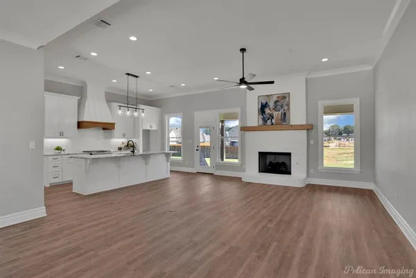 a view of kitchen with cabinets and wooden floor