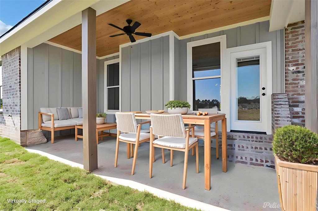 165 Oak Aly Road Stonewall, LA 71078 - Photo 32 of 36 a patio with a table and chairs