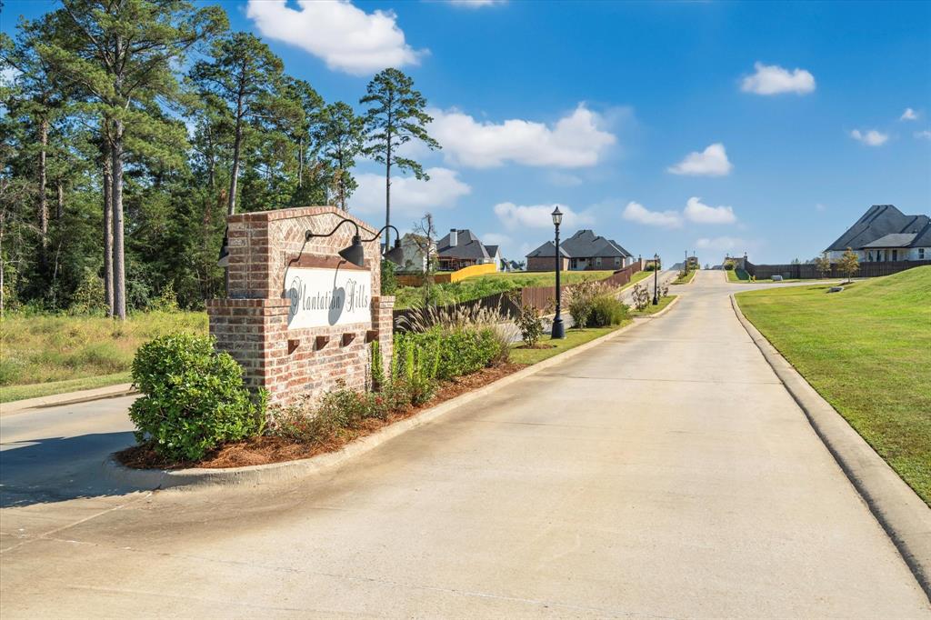 165 Oak Aly Road Stonewall, LA 71078 - Photo 34 of 36 a view of a large building with a yard