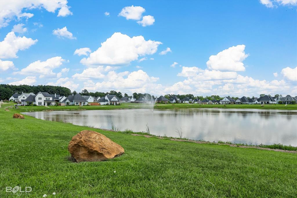 165 Oak Aly Road Stonewall, LA 71078 - Photo 35 of 36 a view of a lake with a city