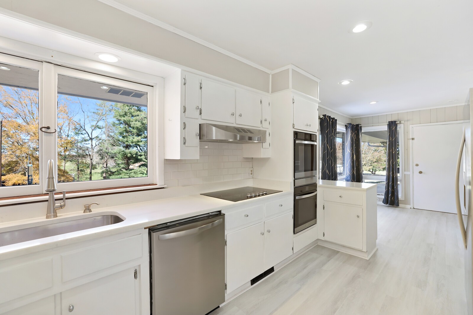 676 Ferguson Hill Road Lafayette, TN 37083 - Photo 16 of 89 a kitchen that has a sink a stove and refrigerator
