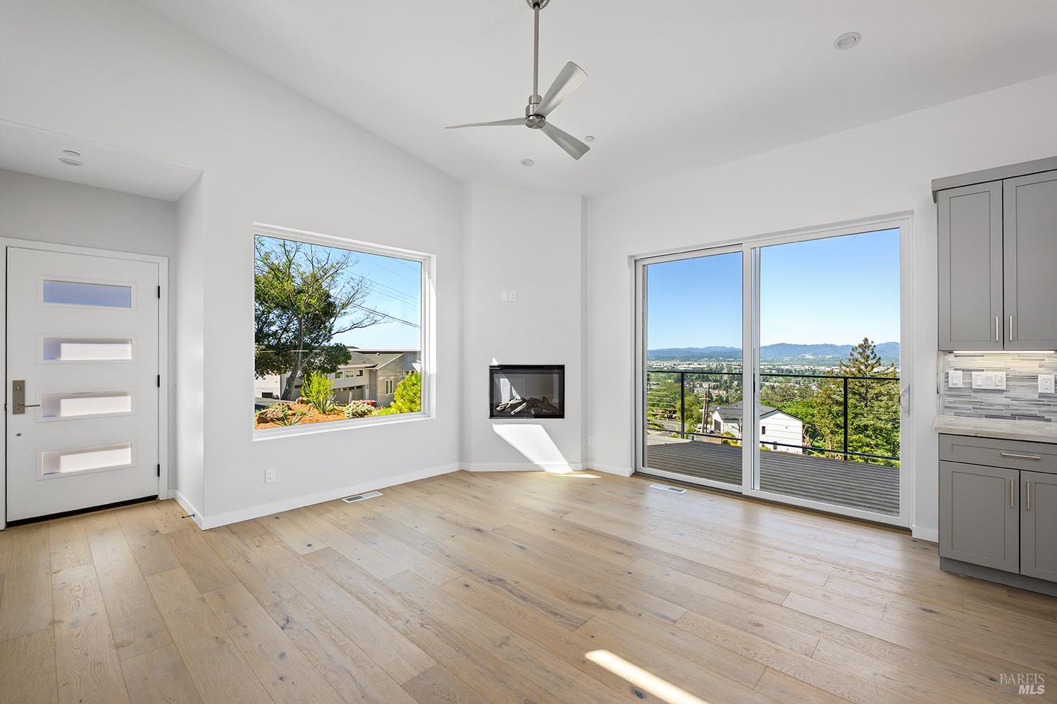 1292 Wikiup Drive Santa Rosa, CA 95403 - Photo 11 of 32 an empty room with window and wooden floor