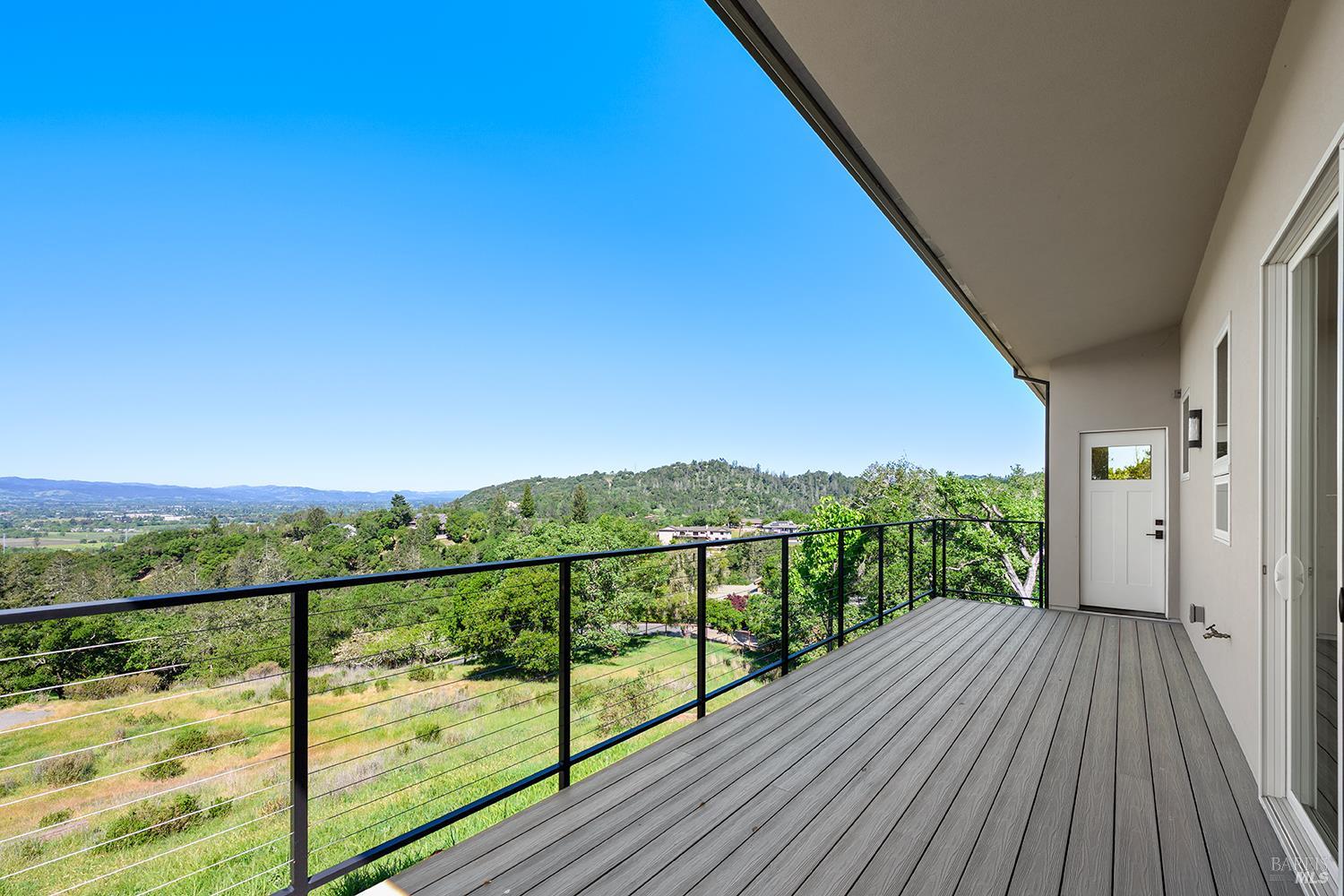 1292 Wikiup Drive Santa Rosa, CA 95403 - Photo 14 of 32 a view of a balcony with wooden floor and city view