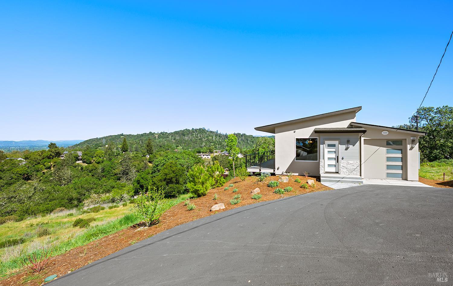 1292 Wikiup Drive Santa Rosa, CA 95403 - Photo 28 of 32 a front view of a house with a yard and garage