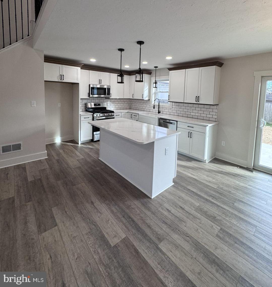 621 Spring Avenue Hanover, PA 17331 - Photo 5 of 11 a kitchen with stainless steel appliances a refrigerator sink and cabinets