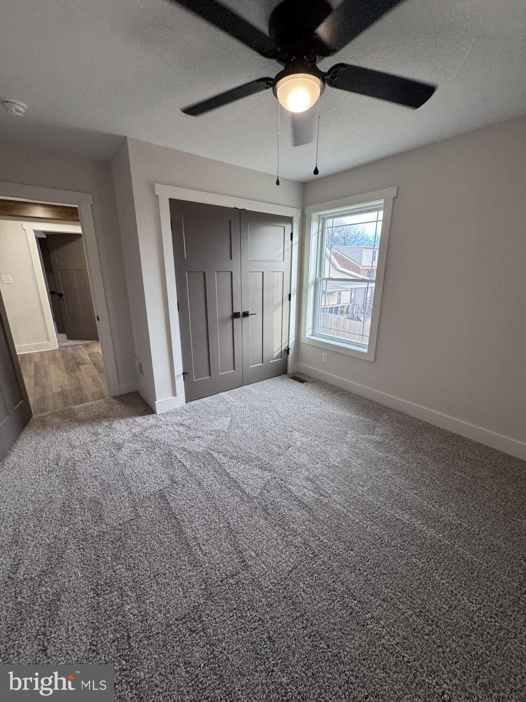 621 Spring Avenue Hanover, PA 17331 - Photo 8 of 11 en empty room with windows and ceiling fan