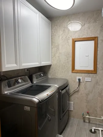 a view of a wooden chairs and table in the balcony