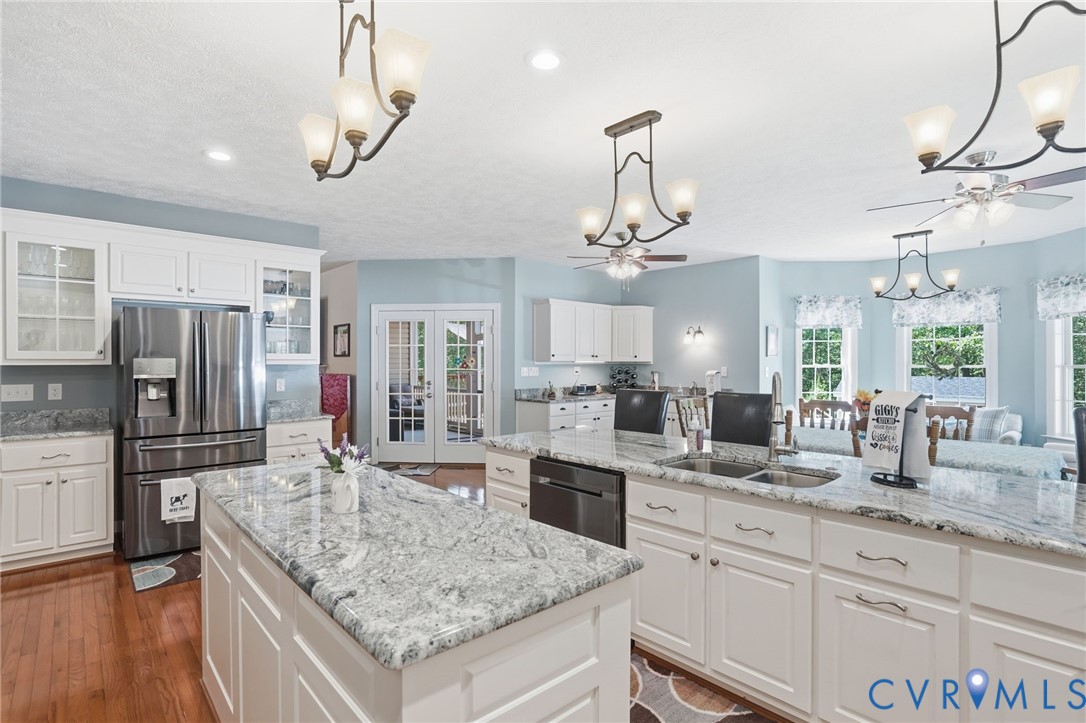 3600 Market Road Mechanicsville, VA 23111 - Photo 18 of 67 a kitchen with stainless steel appliances granite countertop a sink refrigerator and cabinets