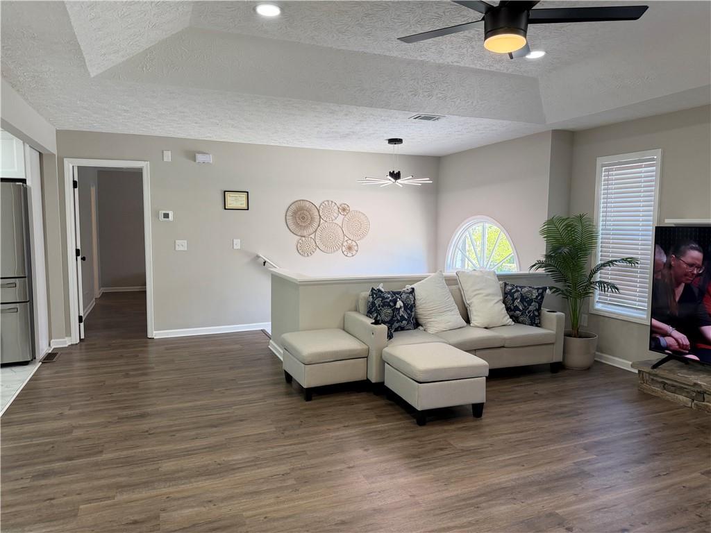 934 Bay Ridge Drive Lawrenceville, GA 30045 - Photo 34 of 78 a living room with furniture and a wooden floor
