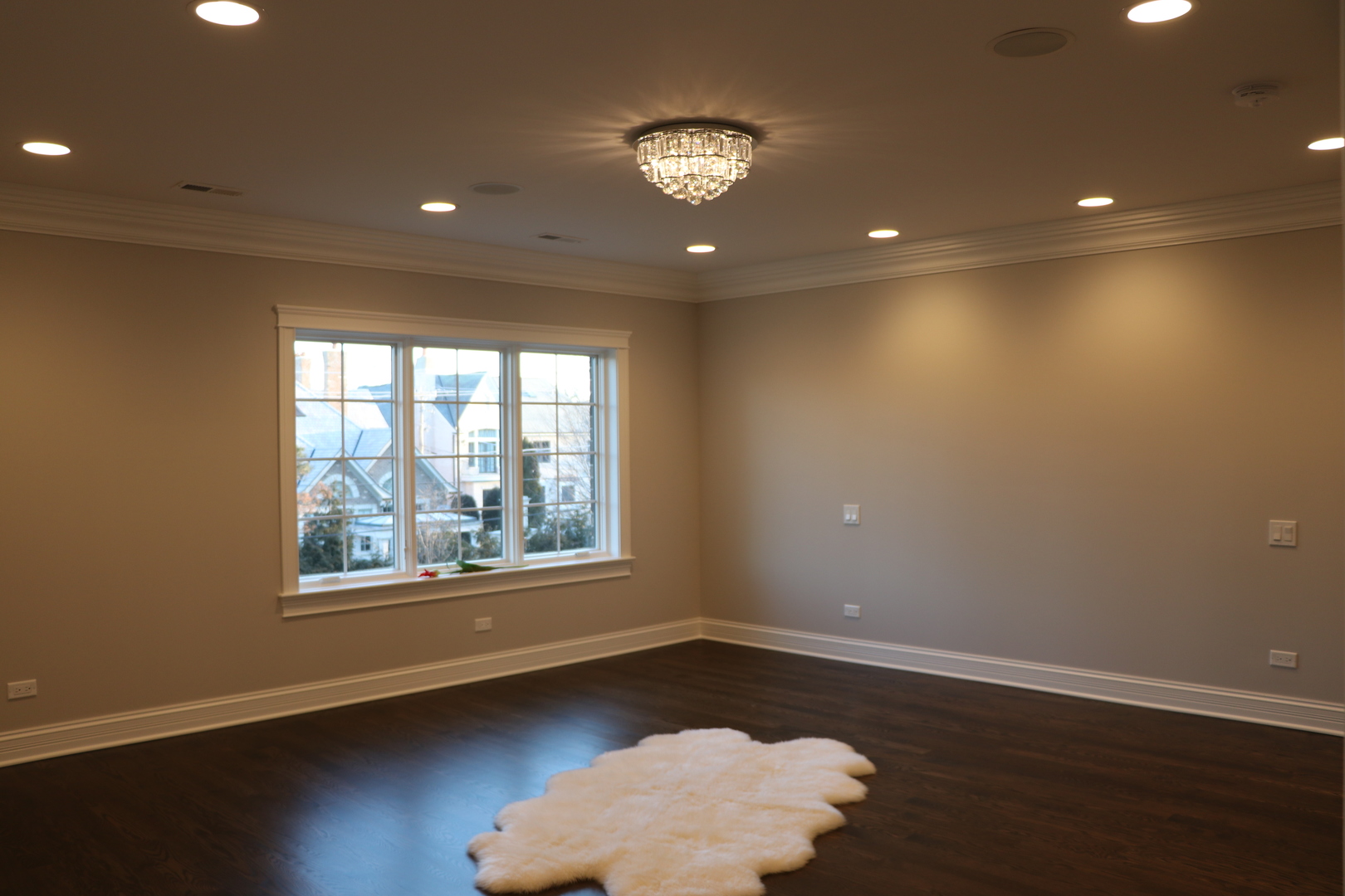2247 Illinois Road Northbrook, IL 60062 - Photo 13 of 32 a view of an empty room with wooden floor and a window