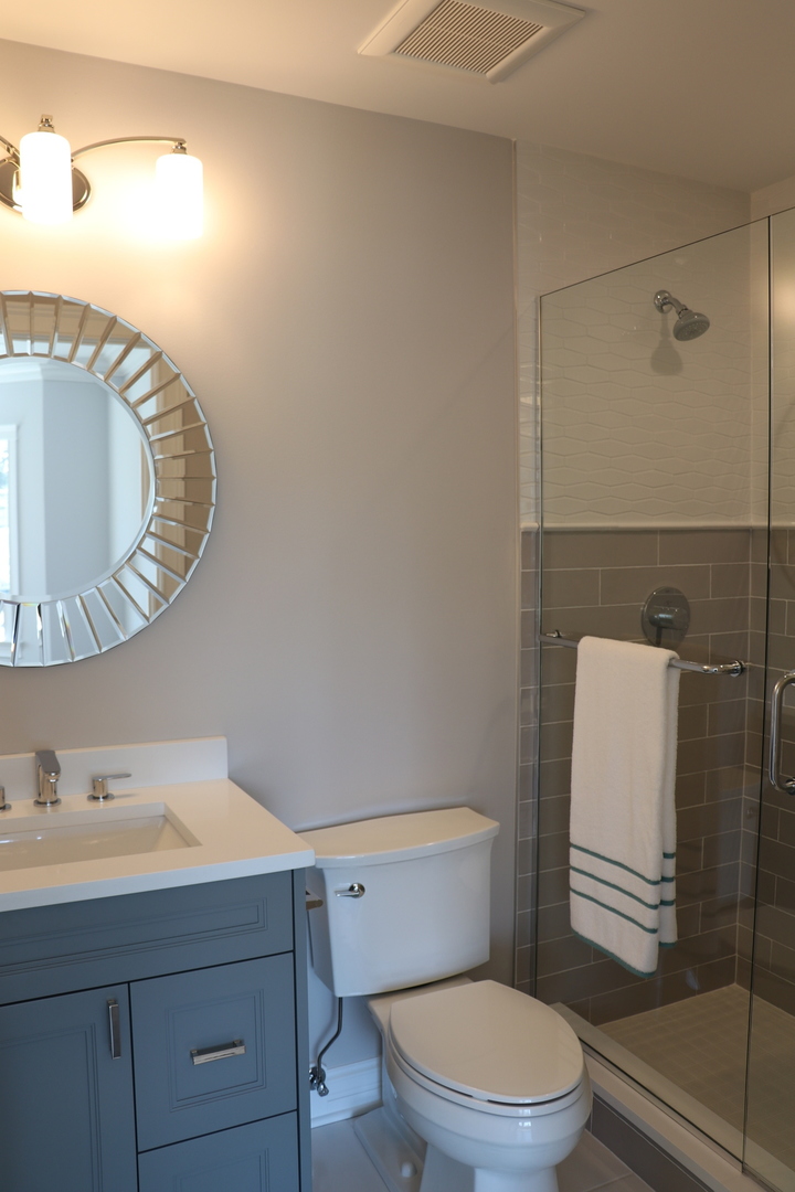 2247 Illinois Road Northbrook, IL 60062 - Photo 18 of 32 a bathroom with a sink a toilet and shower