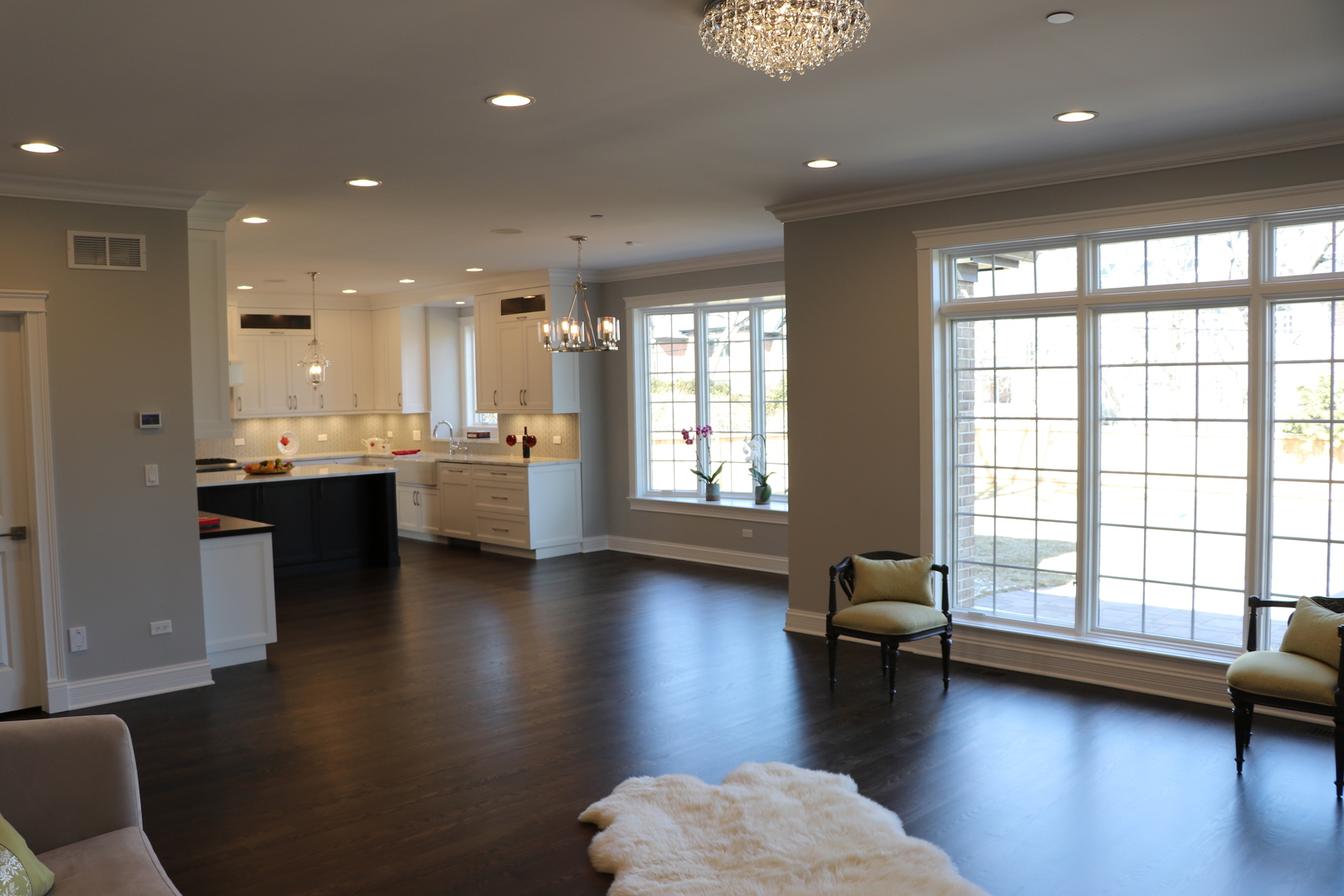 2247 Illinois Road Northbrook, IL 60062 - Photo 4 of 32 a living room with hard wood floors and a kitchen
