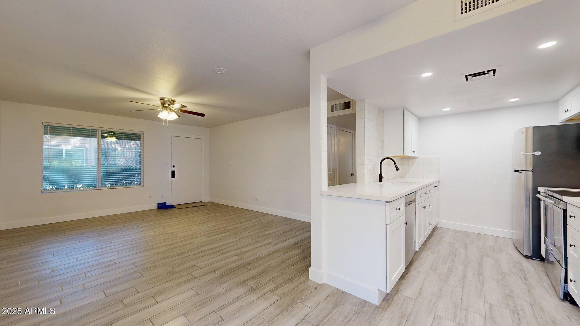 1118 North Granite Reef Road Scottsdale, AZ 85257 - Photo 3 of 12 Living Room & Kitchen