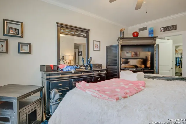 a bed room with a bed and a mirror