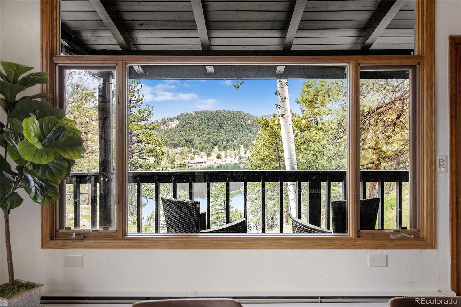 28433 Kinnikinnick Road Evergreen, CO 80439 - Photo 4 of 29 a view of a porch