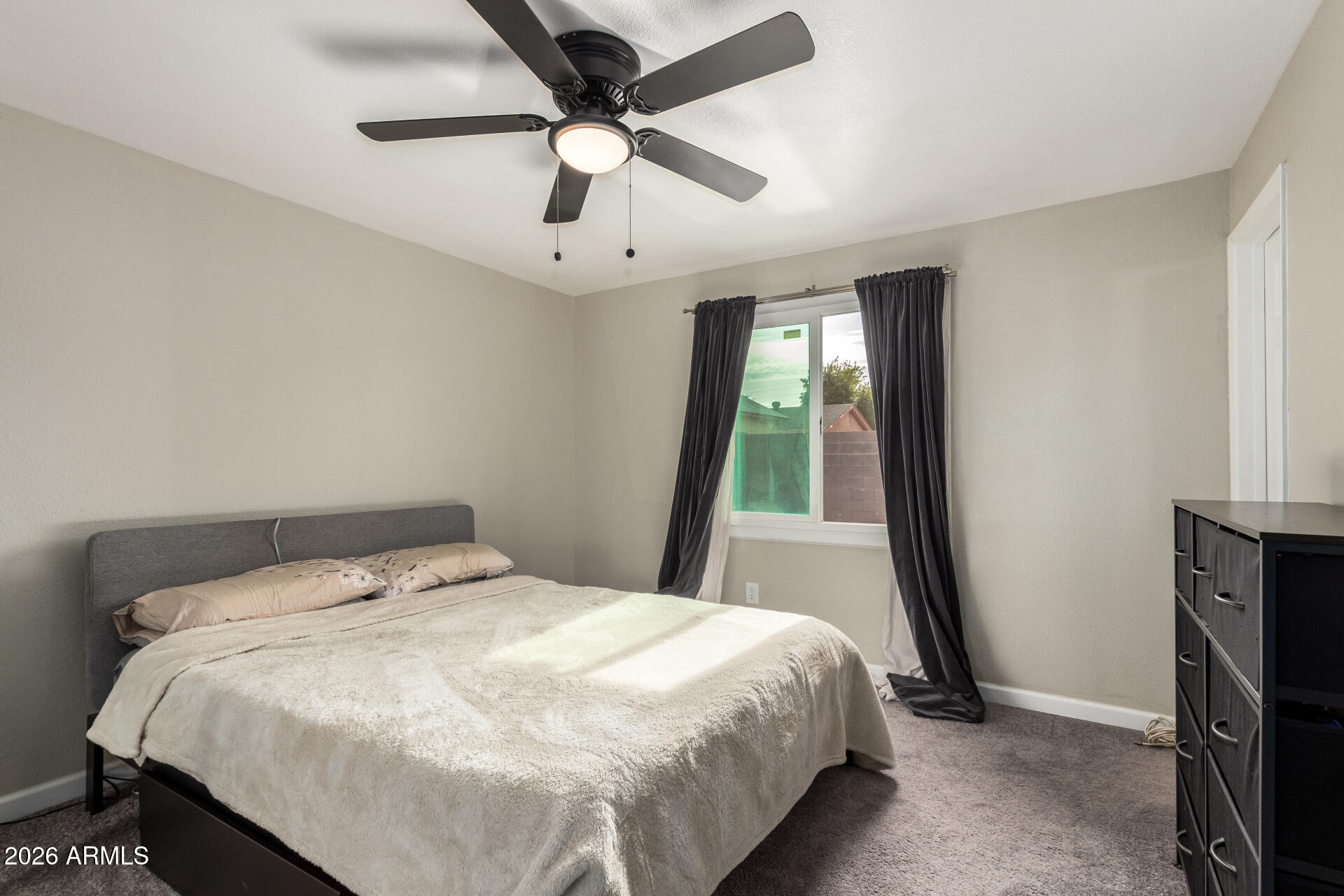 6423 West Almeria Road Phoenix, AZ 85035 - Photo 13 of 31 a bedroom with a bed and a large window