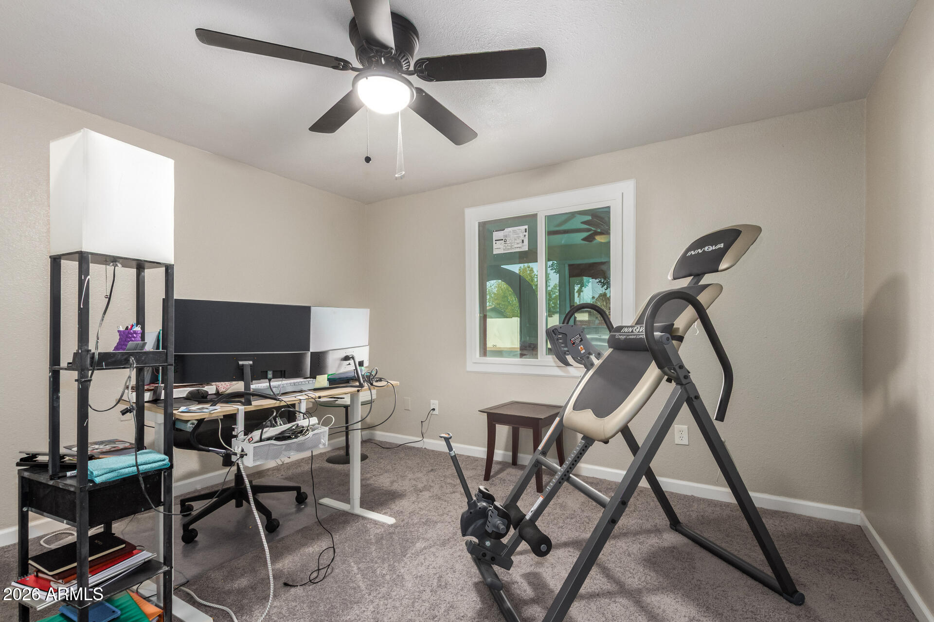 6423 West Almeria Road Phoenix, AZ 85035 - Photo 19 of 31 a view of a workspace with furniture and a window