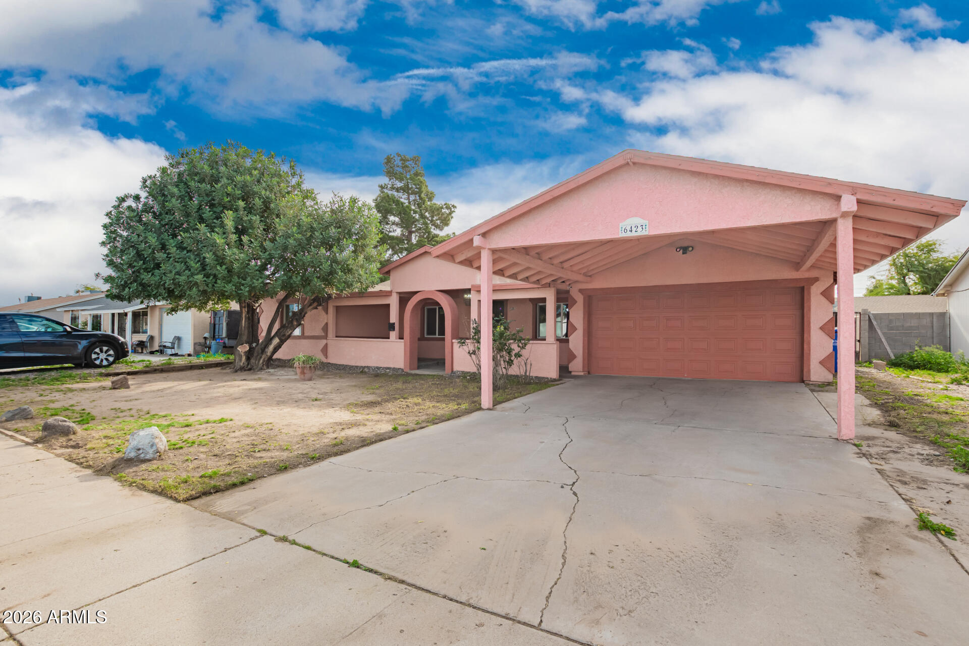 6423 West Almeria Road Phoenix, AZ 85035 - Photo 2 of 31 a view of a house with a yard