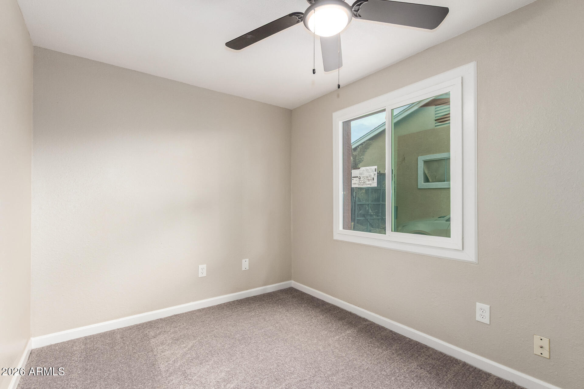 6423 West Almeria Road Phoenix, AZ 85035 - Photo 21 of 31 an empty room with a window