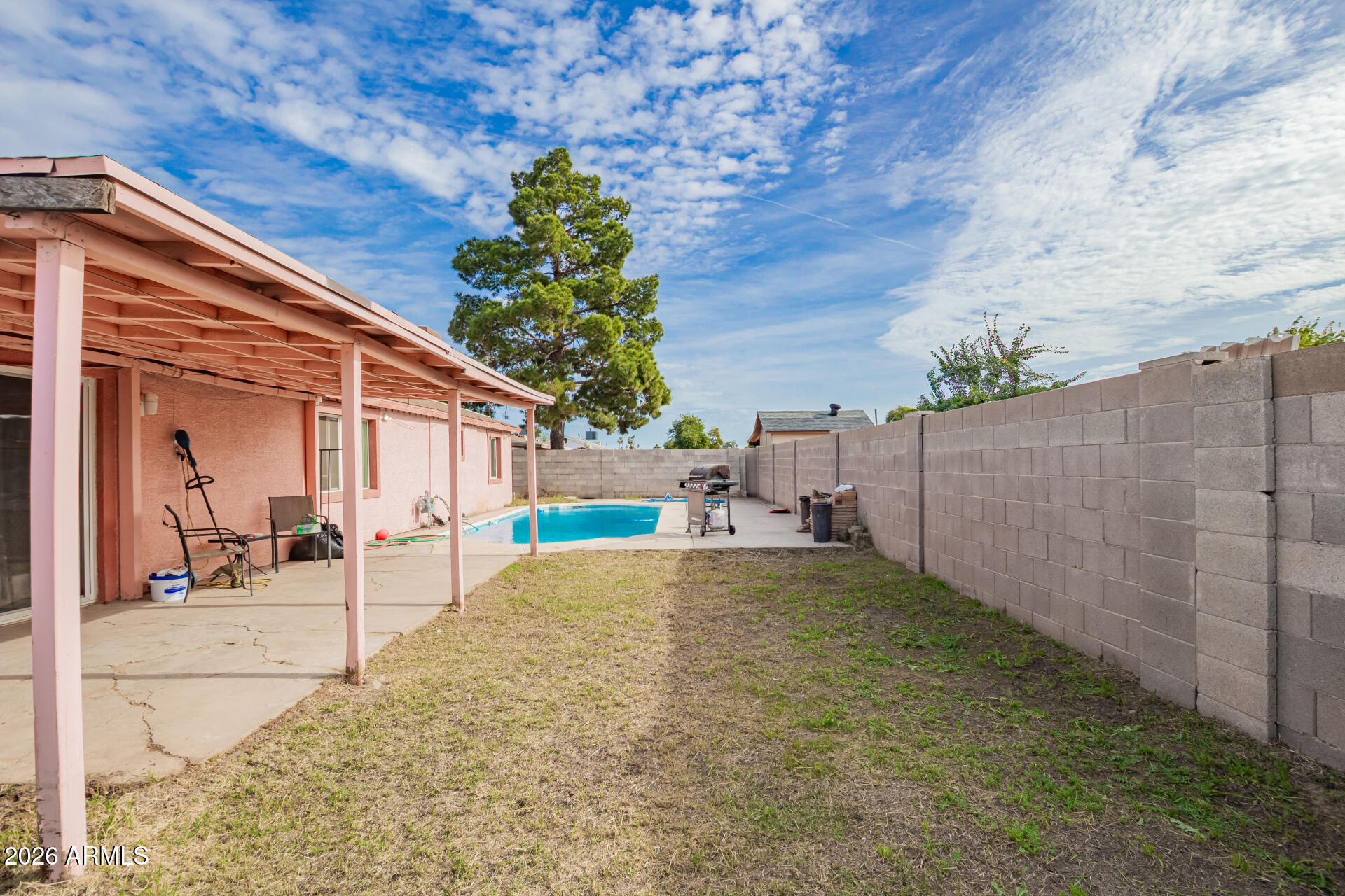 6423 West Almeria Road Phoenix, AZ 85035 - Photo 25 of 31 a backyard of a house with table and chairs