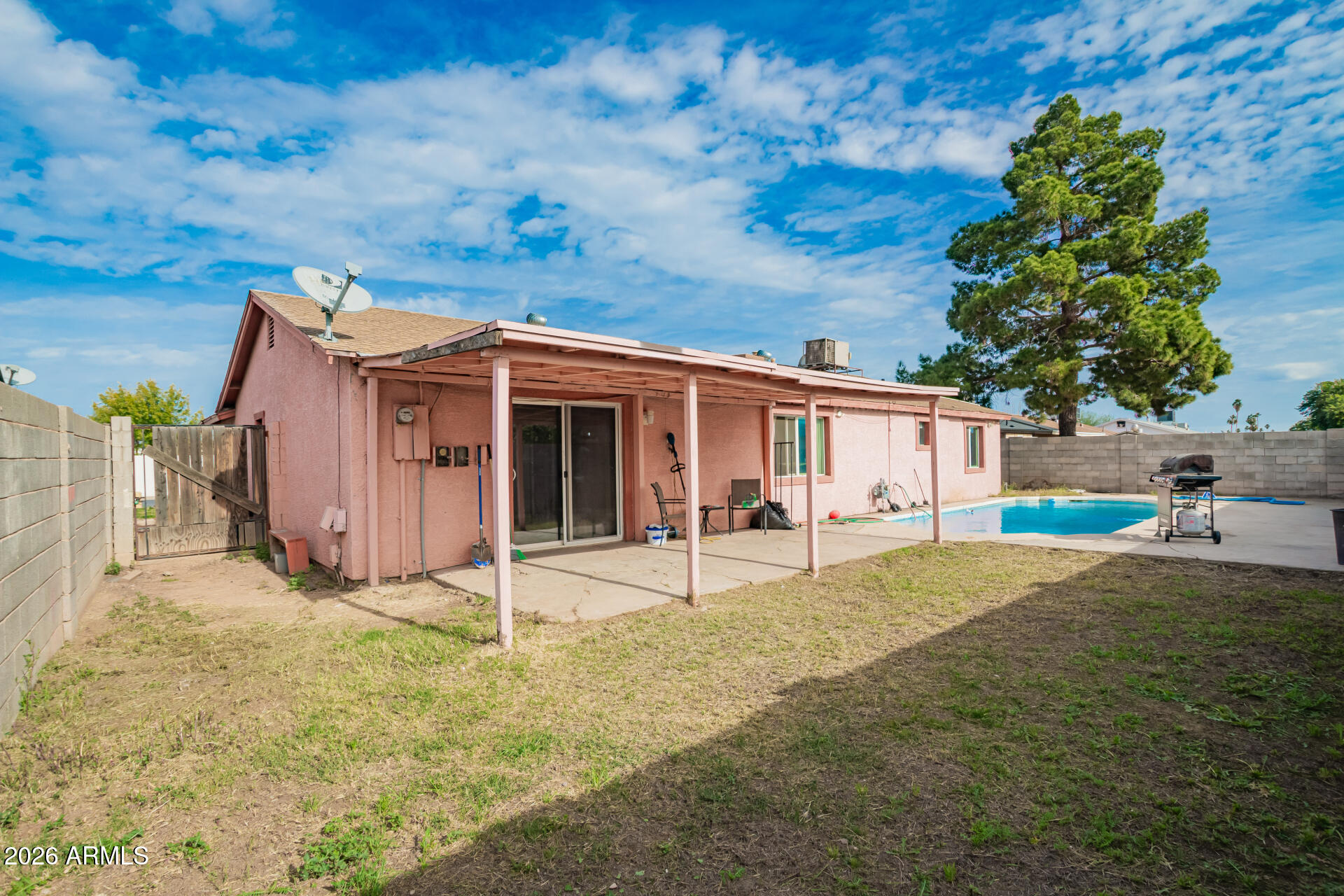 6423 West Almeria Road Phoenix, AZ 85035 - Photo 26 of 31 a backyard of a house with table and chairs