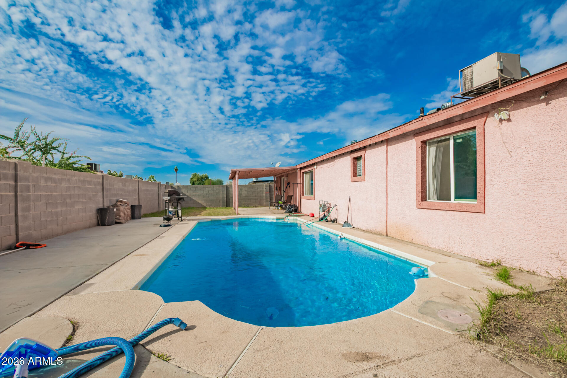 6423 West Almeria Road Phoenix, AZ 85035 - Photo 28 of 31 a view of a swimming pool with a patio
