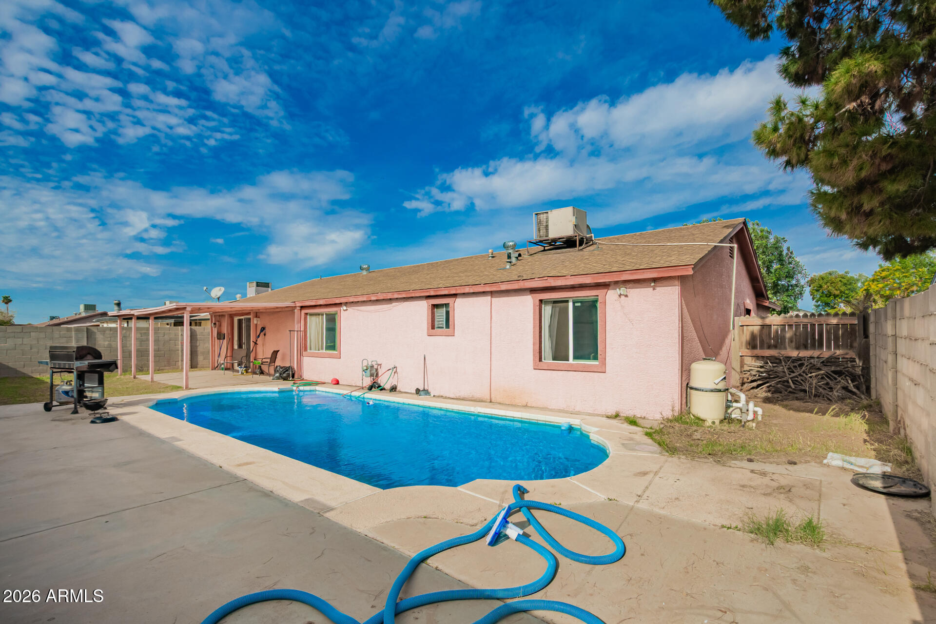 6423 West Almeria Road Phoenix, AZ 85035 - Photo 29 of 31 a view of a house with pool and chairs