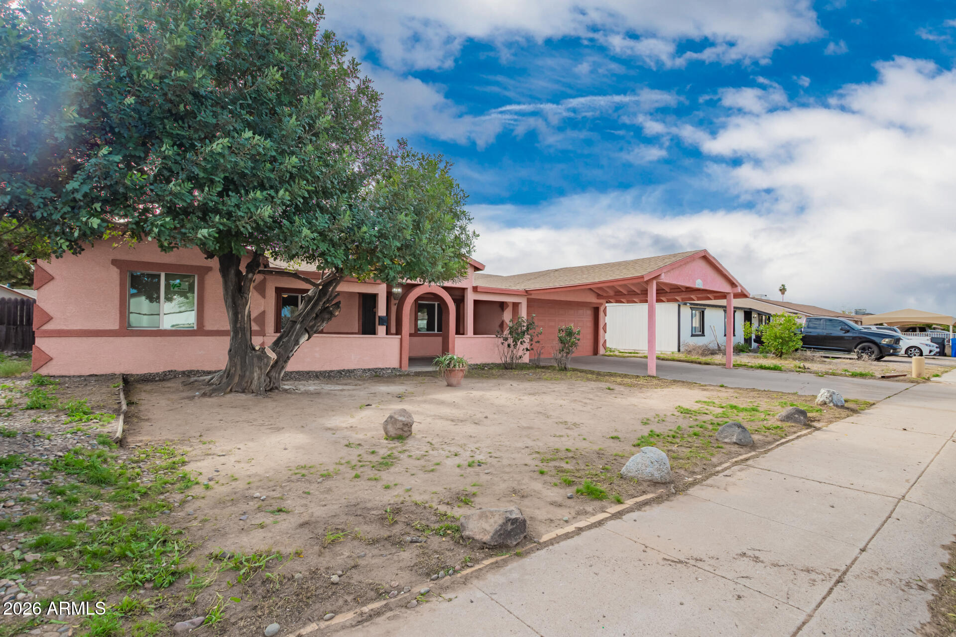 6423 West Almeria Road Phoenix, AZ 85035 - Photo 30 of 31 a front view of a house with a yard