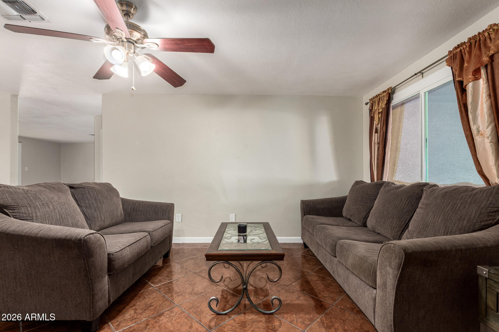 6423 West Almeria Road Phoenix, AZ 85035 - Photo 6 of 31 a living room with furniture and a rug