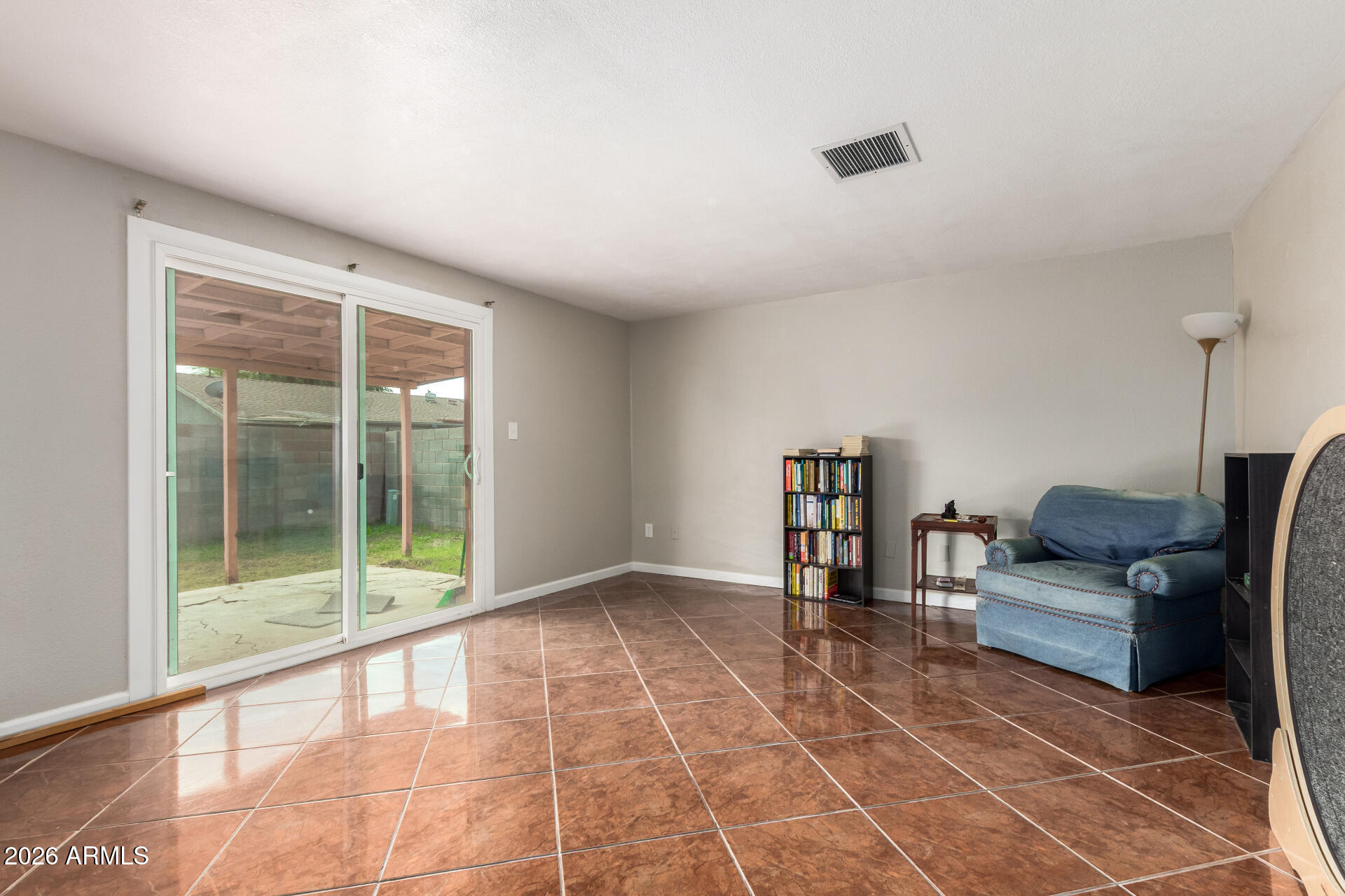 6423 West Almeria Road Phoenix, AZ 85035 - Photo 7 of 31 a living room with furniture and a floor to ceiling window