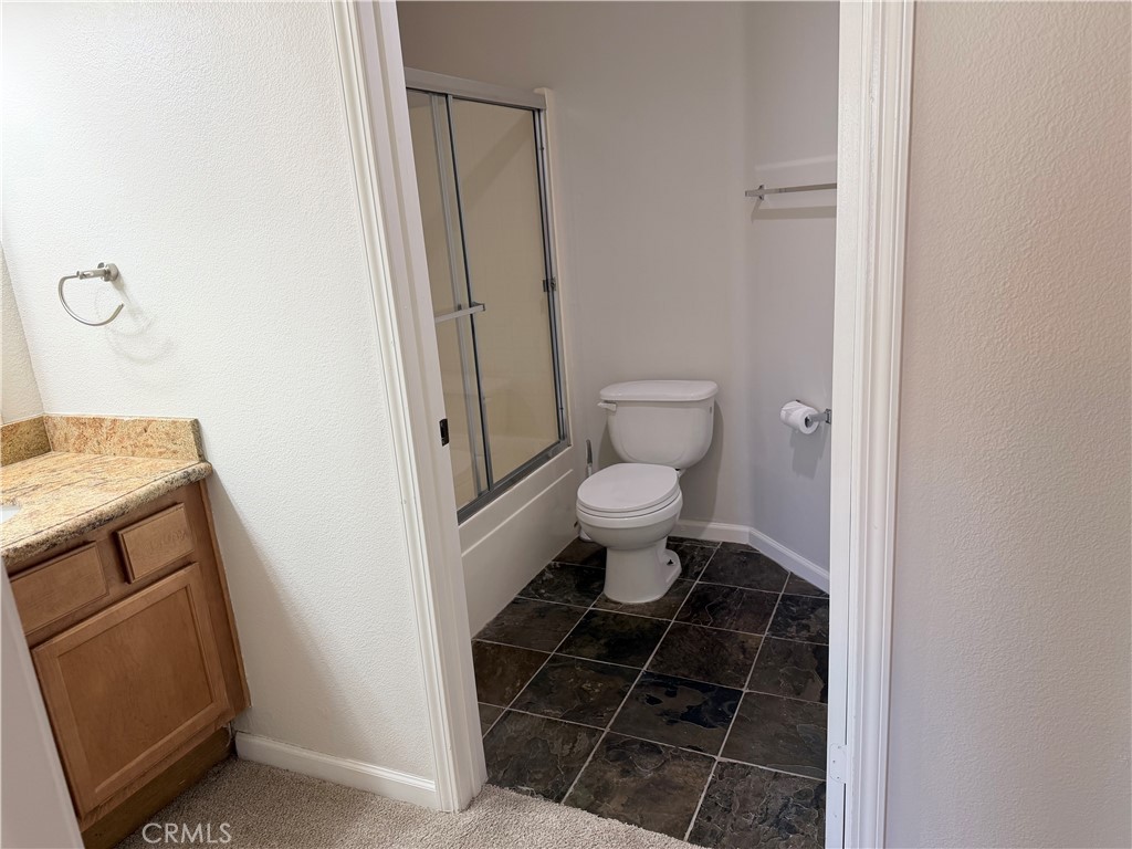 375 Central Avenue, Unit 14 Riverside, CA 92507 - Photo 13 of 32 a bathroom with a sink and a toilet