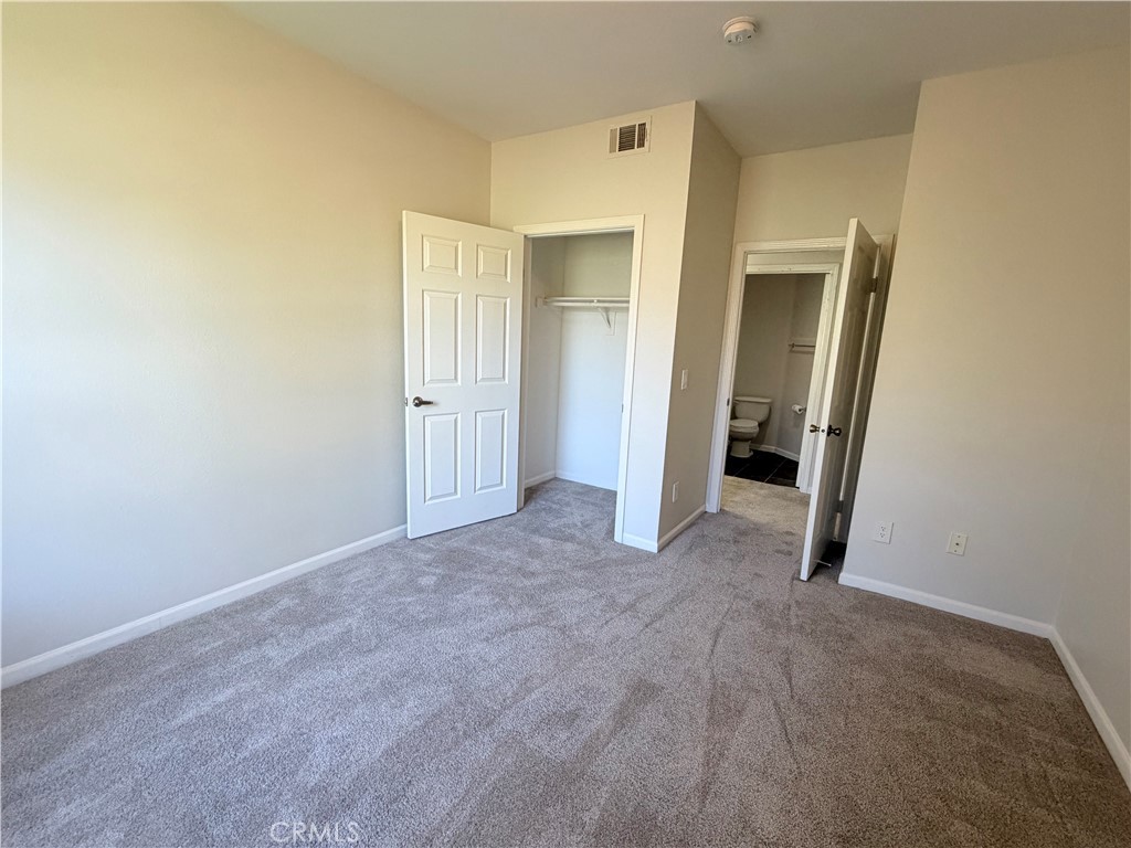 375 Central Avenue, Unit 14 Riverside, CA 92507 - Photo 16 of 32 a view of an empty room and closet area