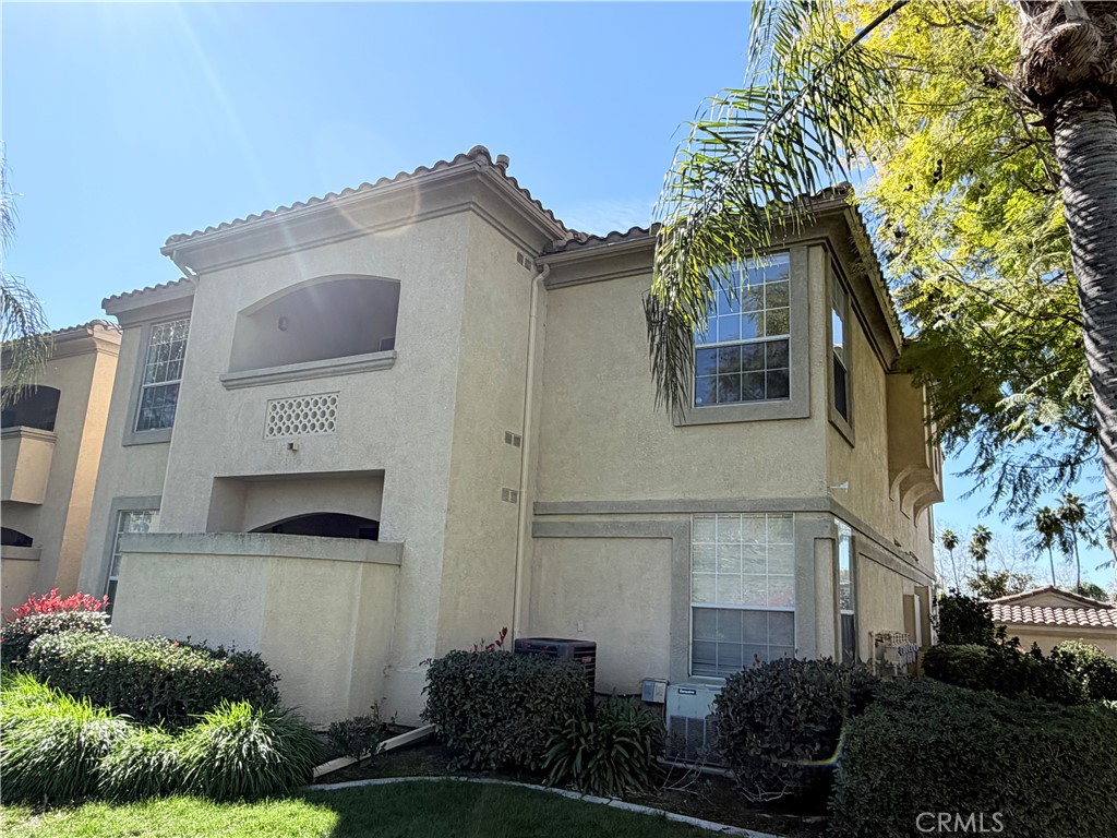 375 Central Avenue, Unit 14 Riverside, CA 92507 - Photo 2 of 32 a front view of a house with garden