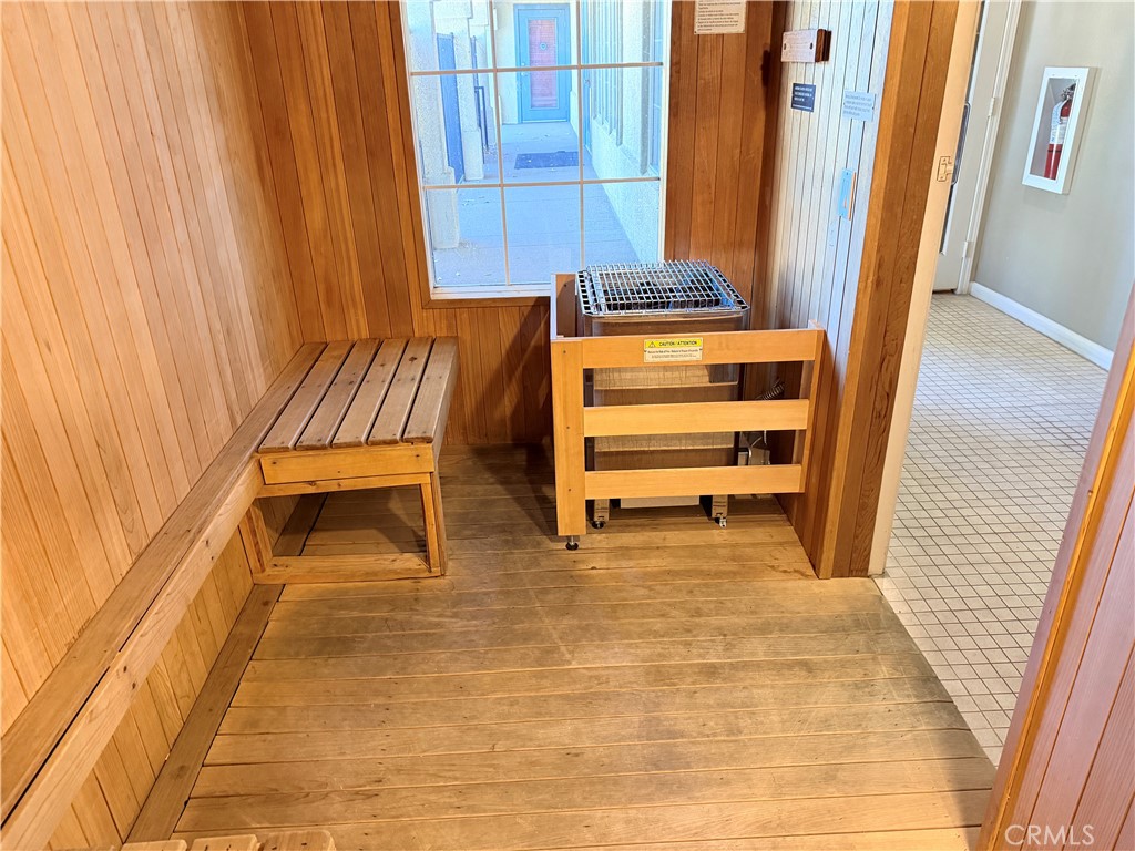 375 Central Avenue, Unit 14 Riverside, CA 92507 - Photo 28 of 32 a room with a bench and chair