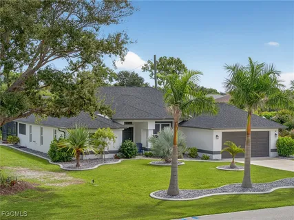 a front view of a house with a yard