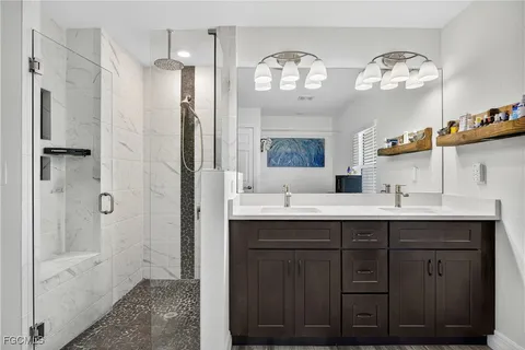 a bathroom with a double vanity sink and a mirror