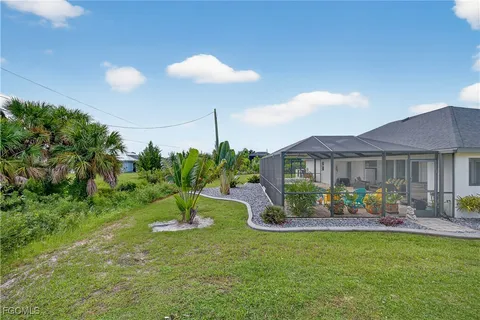 a view of a house with a backyard porch and sitting area