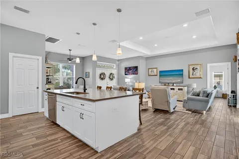 a large living room with lots of counter space and furniture