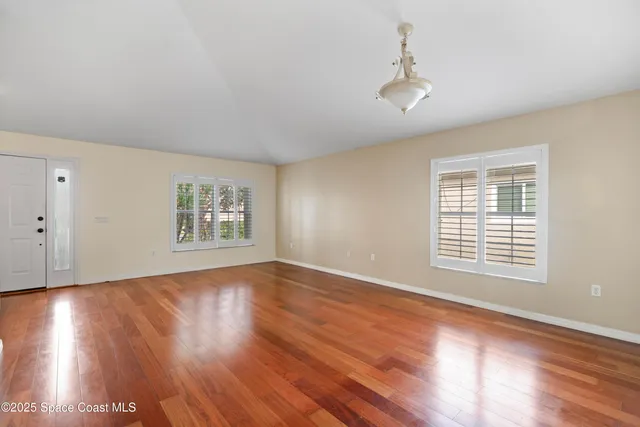 a view of a kitchen with furniture and a ceiling fan