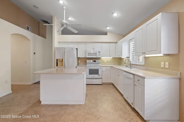 a bathroom with a double vanity sink a mirror and a bathtub