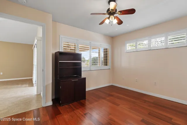 a view of an empty room with a balcony