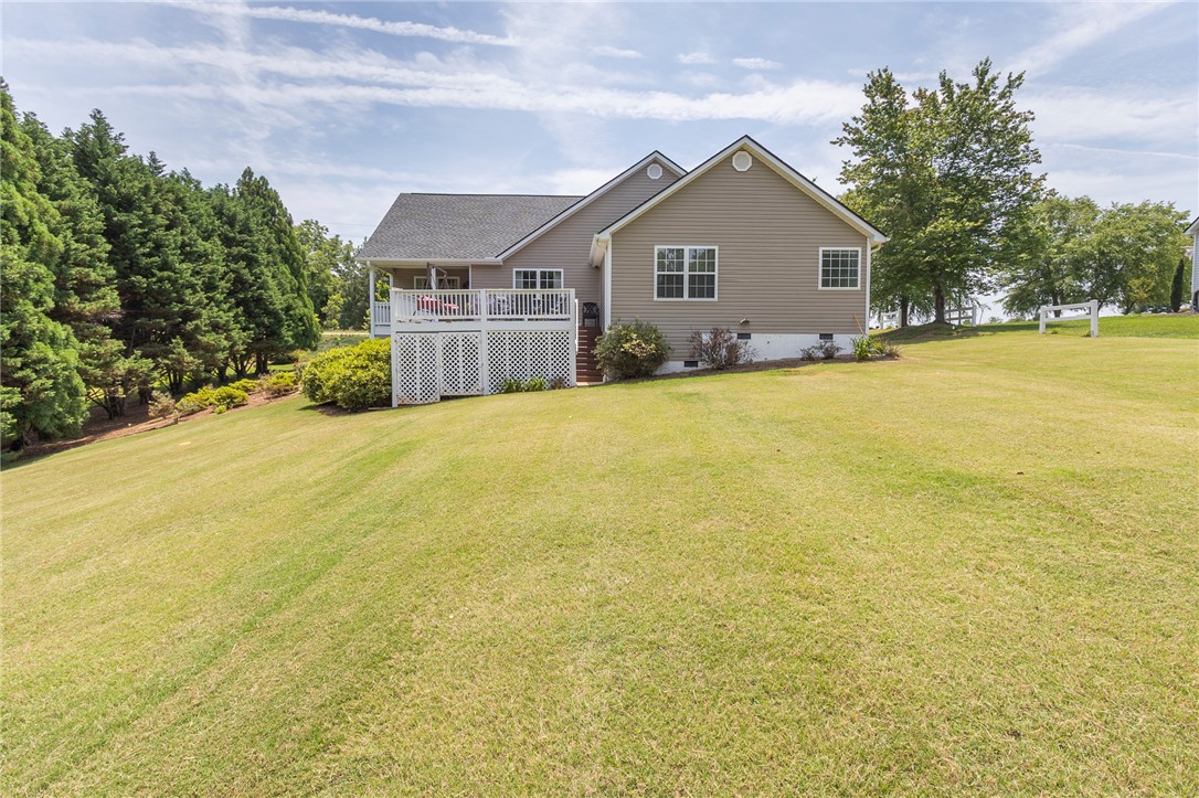 861 North Old Pendleton Road Liberty, SC 29657 - Photo 40 of 45 A spacious backyard with mature trees and a multi-level deck, perfect for outdoor enjoyment.