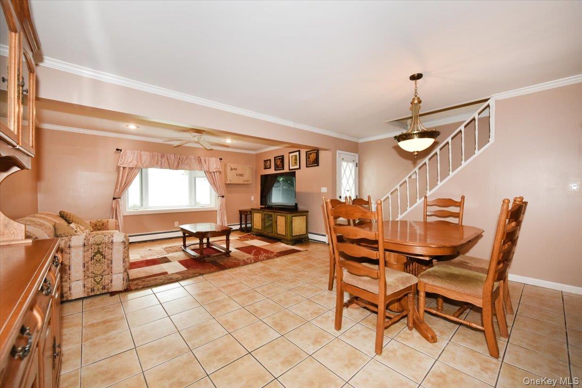 307 Blacksmith Road Levittown, NY 11756 - Photo 10 of 27 a dining room with furniture and wooden floor